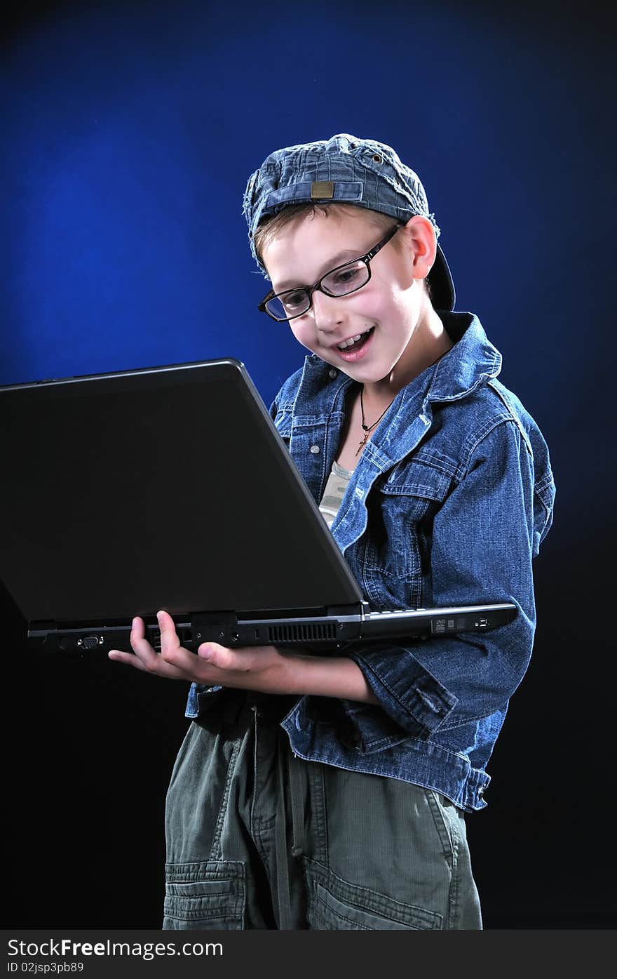 Boy of ten years is led away a game on the computer. Boy of ten years is led away a game on the computer