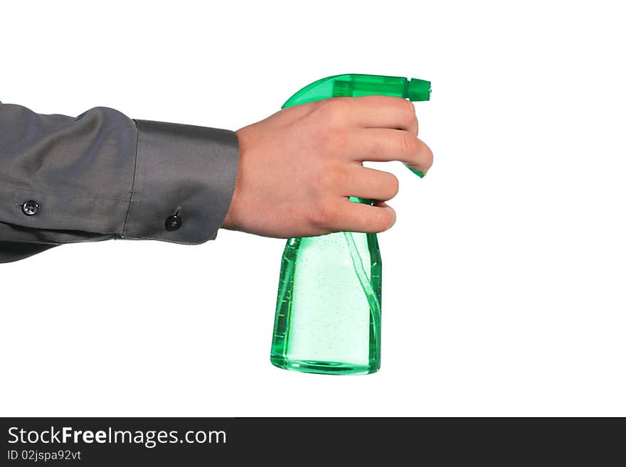 The man's hand holds a spray for water dispersion.