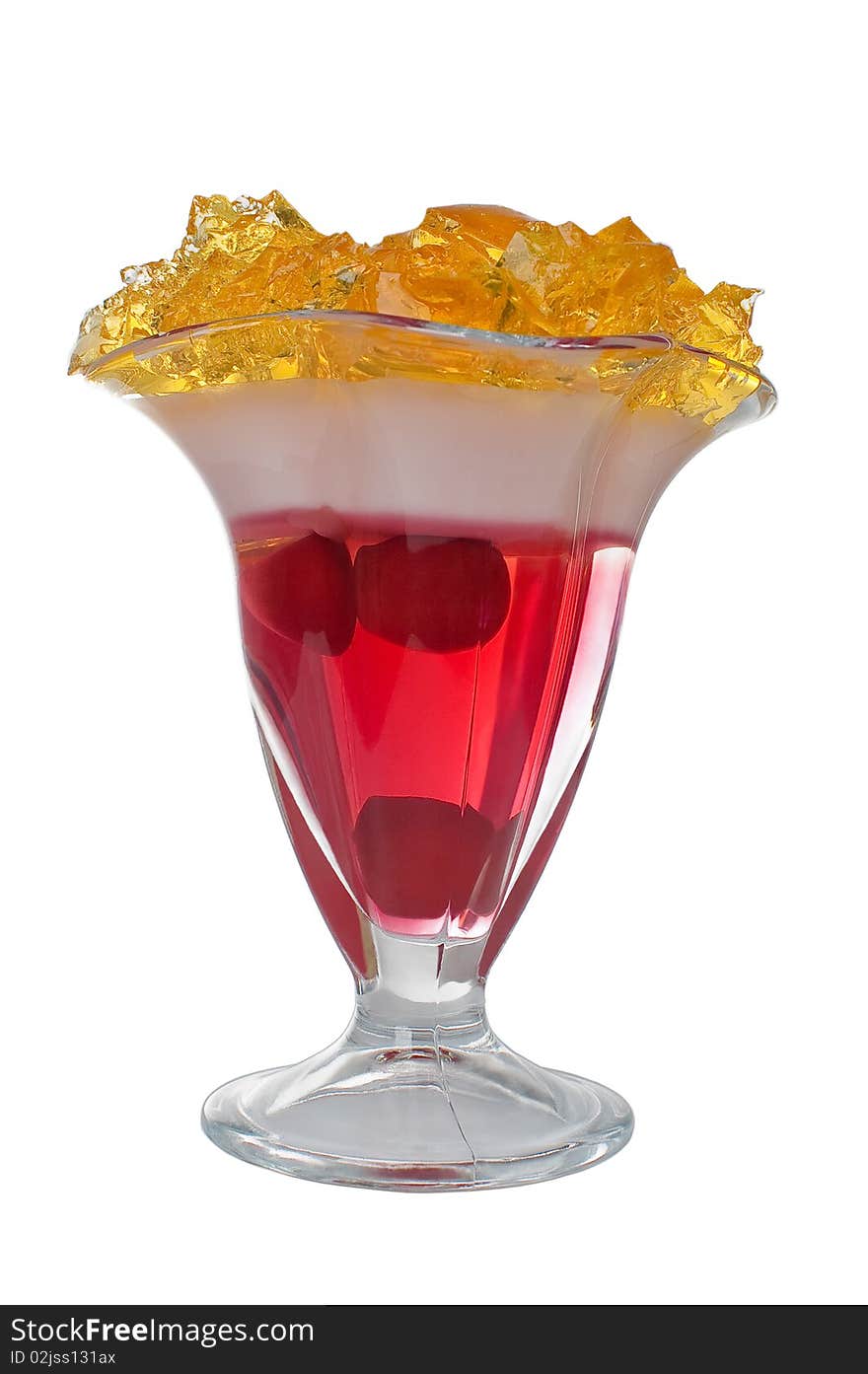 Yellow, red and white jelly in a glass. Yellow, red and white jelly in a glass