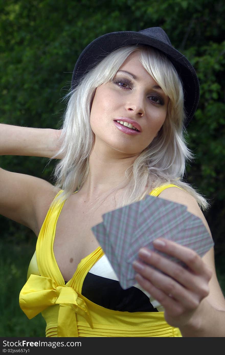 Lady in a country hat with cards. Lady in a country hat with cards