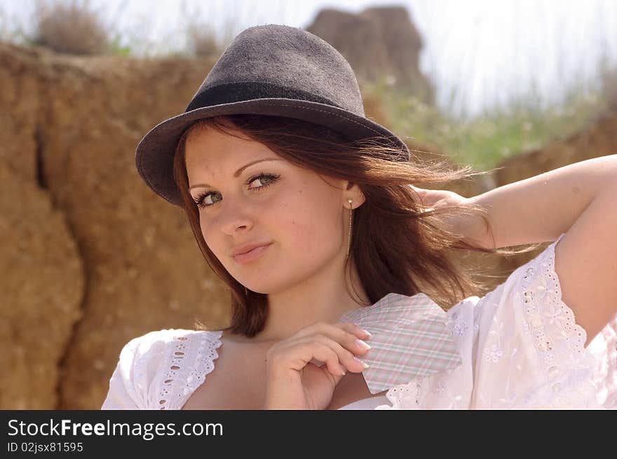 Lady in a country hat with cards. Lady in a country hat with cards