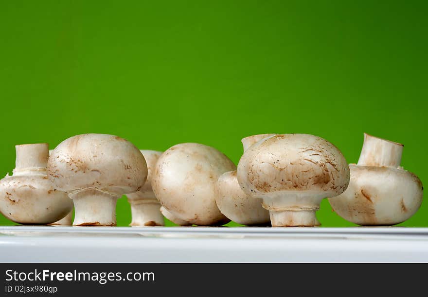 Fresh mushrooms on a white table