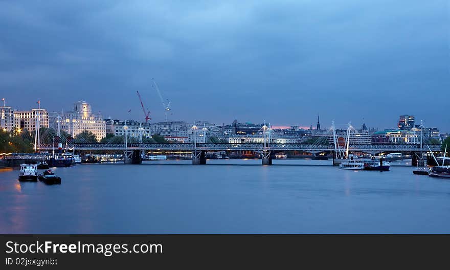 View of the Themes  and a bridge in London at the evening. View of the Themes  and a bridge in London at the evening