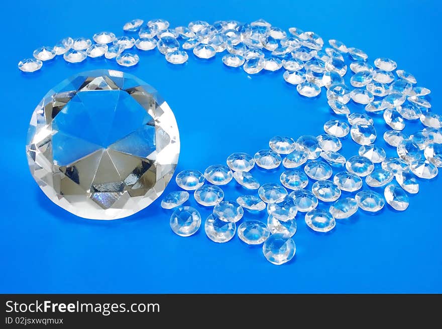 White faceted stones on a blue background