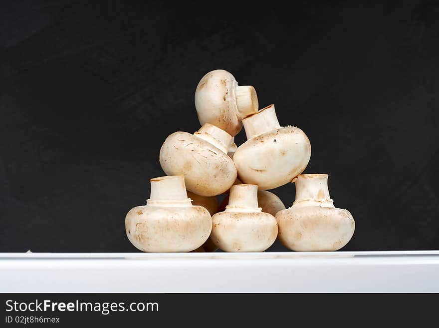 Fresh mushrooms on a white table