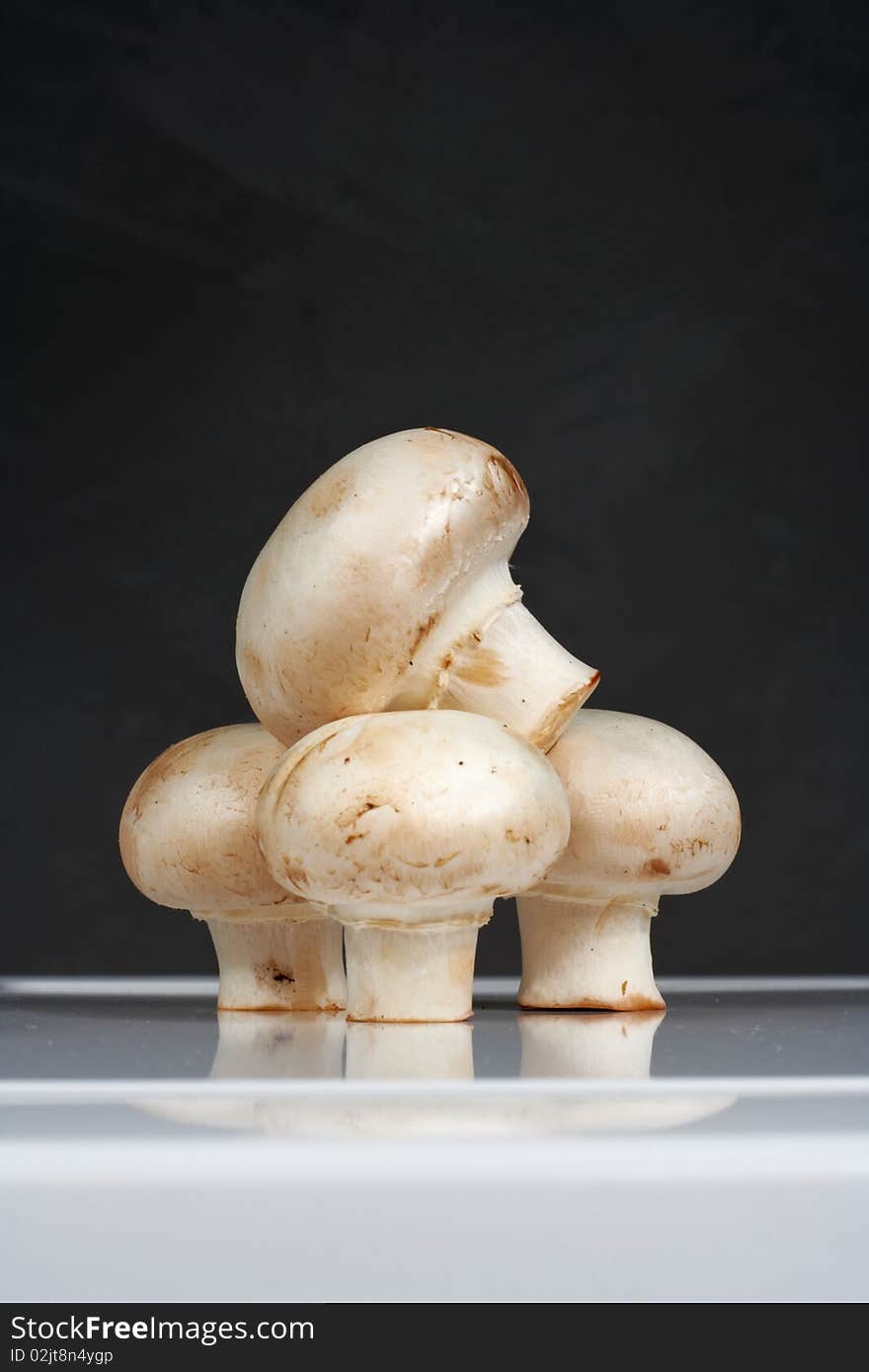 Fresh Mushrooms On A White Table