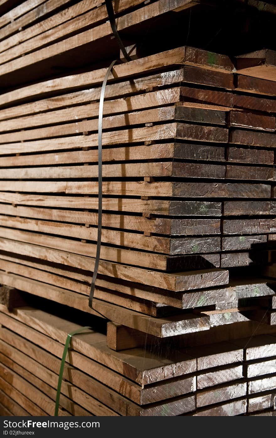 Tacks of a hardwood in lumber warehouse ready for transportation. Tacks of a hardwood in lumber warehouse ready for transportation.