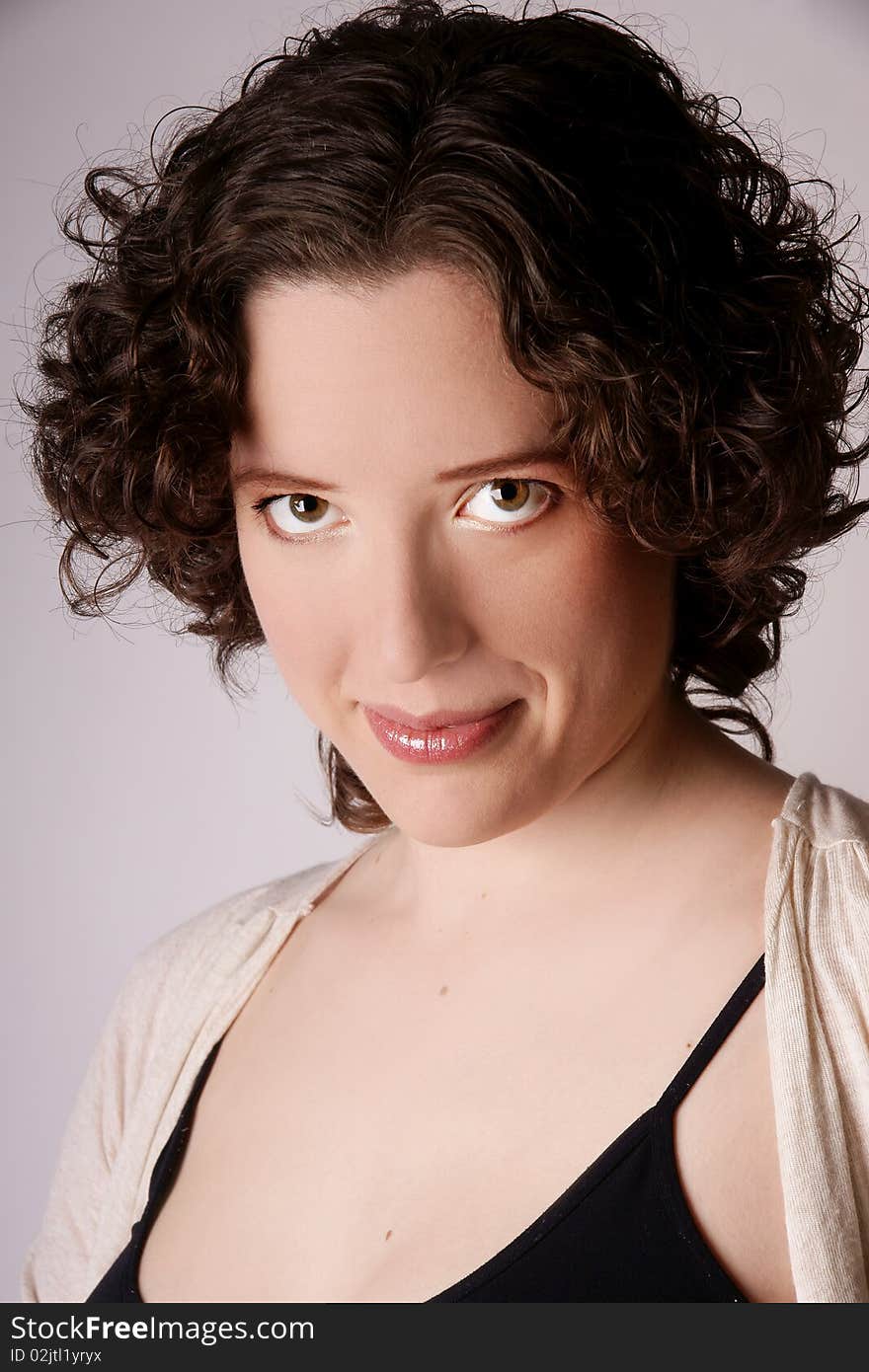 Portrait of beautiful smiling young woman, studio shot