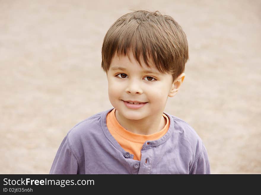 Portrait of cute little smiling boy, outdoor shot