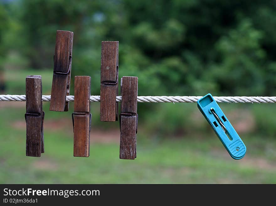 Clip for clothes in a rope against sand of thailand