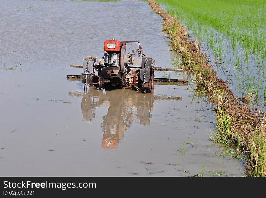 Pluogh machine in the paddy field