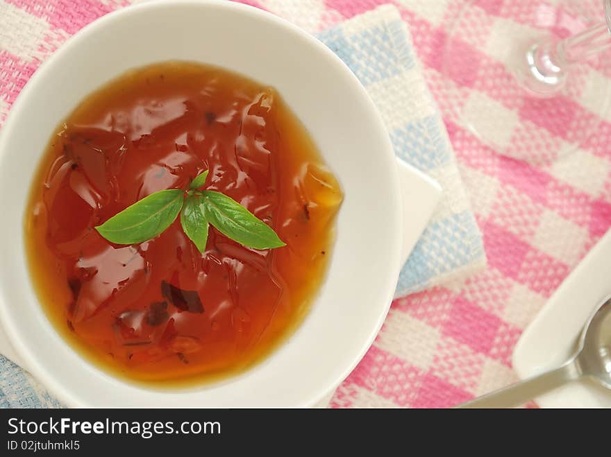 Sweet and refreshing Oriental jelly dessert made from healthy Chinese herbal ingredients on pink background. For diet and nutrition, food and beverage, and healthy lifestyle concepts. Sweet and refreshing Oriental jelly dessert made from healthy Chinese herbal ingredients on pink background. For diet and nutrition, food and beverage, and healthy lifestyle concepts.