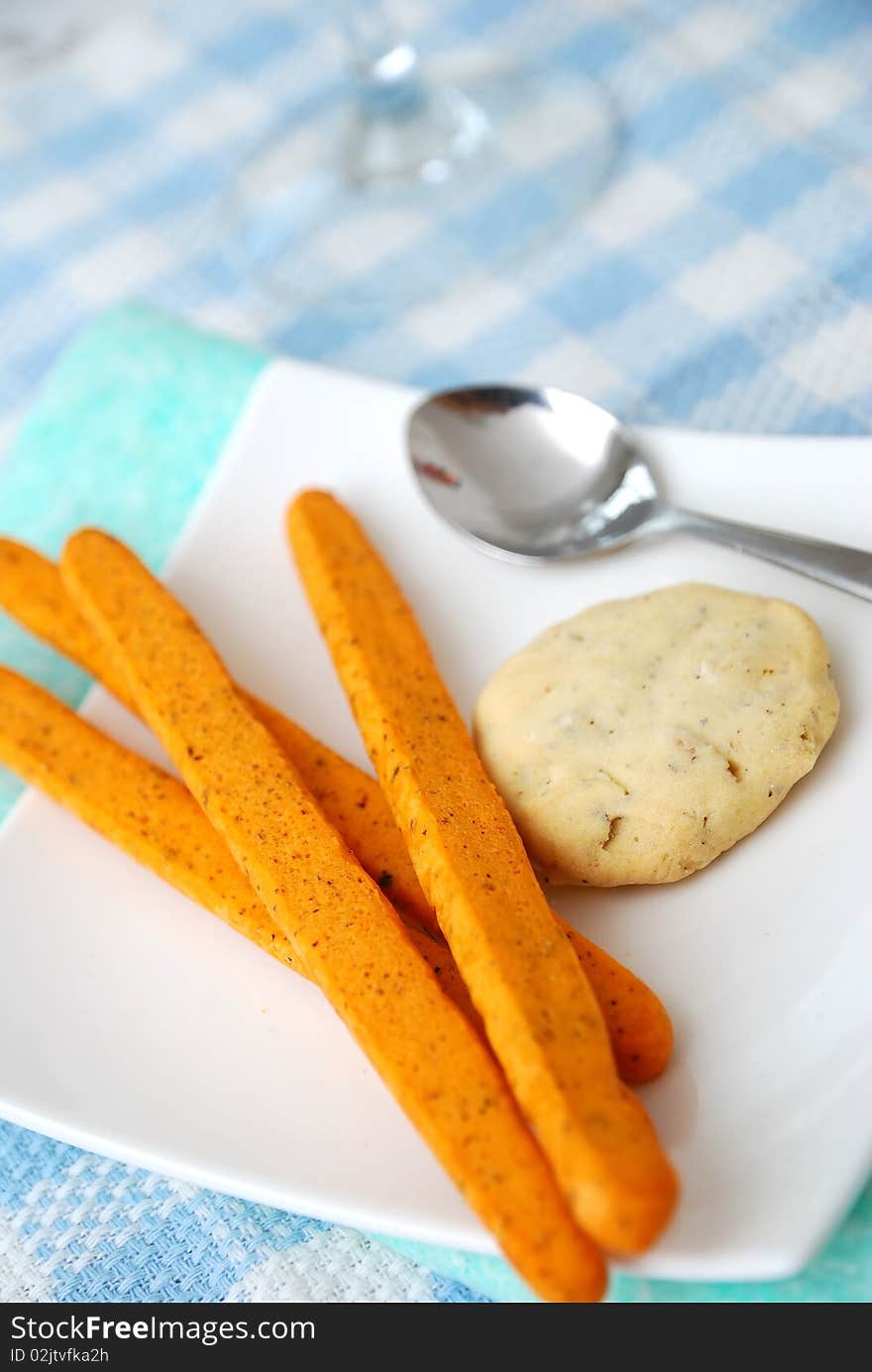 Healthy cookies filled with nuts and tomato sticks for a healthy and nutritious afternoon snack. Concepts such as food and beverage, diet and nutrition, and healthy lifestyle. Healthy cookies filled with nuts and tomato sticks for a healthy and nutritious afternoon snack. Concepts such as food and beverage, diet and nutrition, and healthy lifestyle.