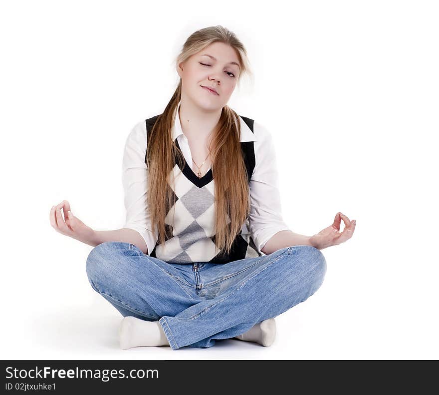 Blond woman meditating in lotus position isolated on white