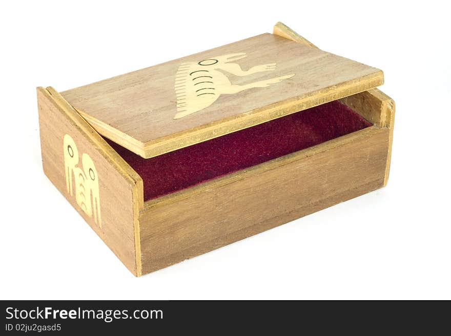 A handmade Ecuadorean box with inlaid stylized iguana, open to show the red felt interior. A handmade Ecuadorean box with inlaid stylized iguana, open to show the red felt interior