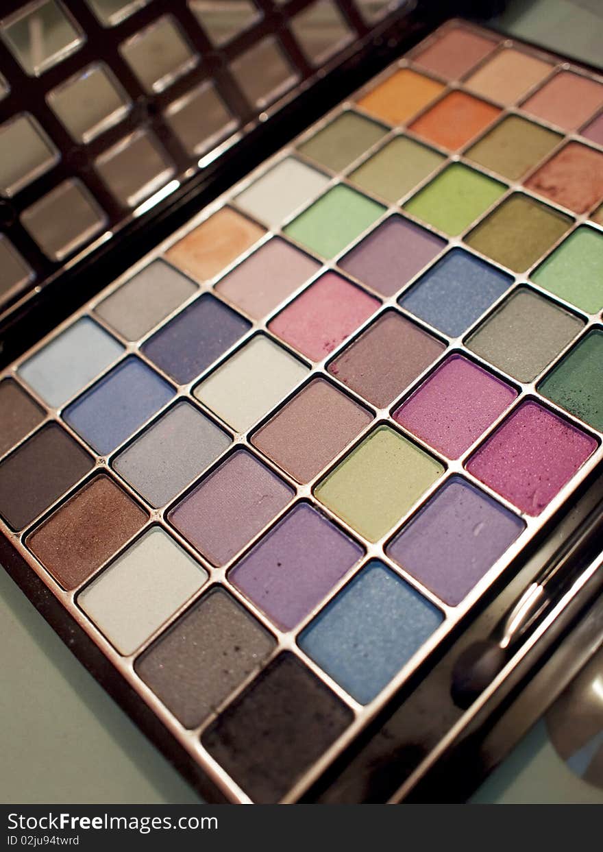 A box of colorful eye shadows palette. A box of colorful eye shadows palette