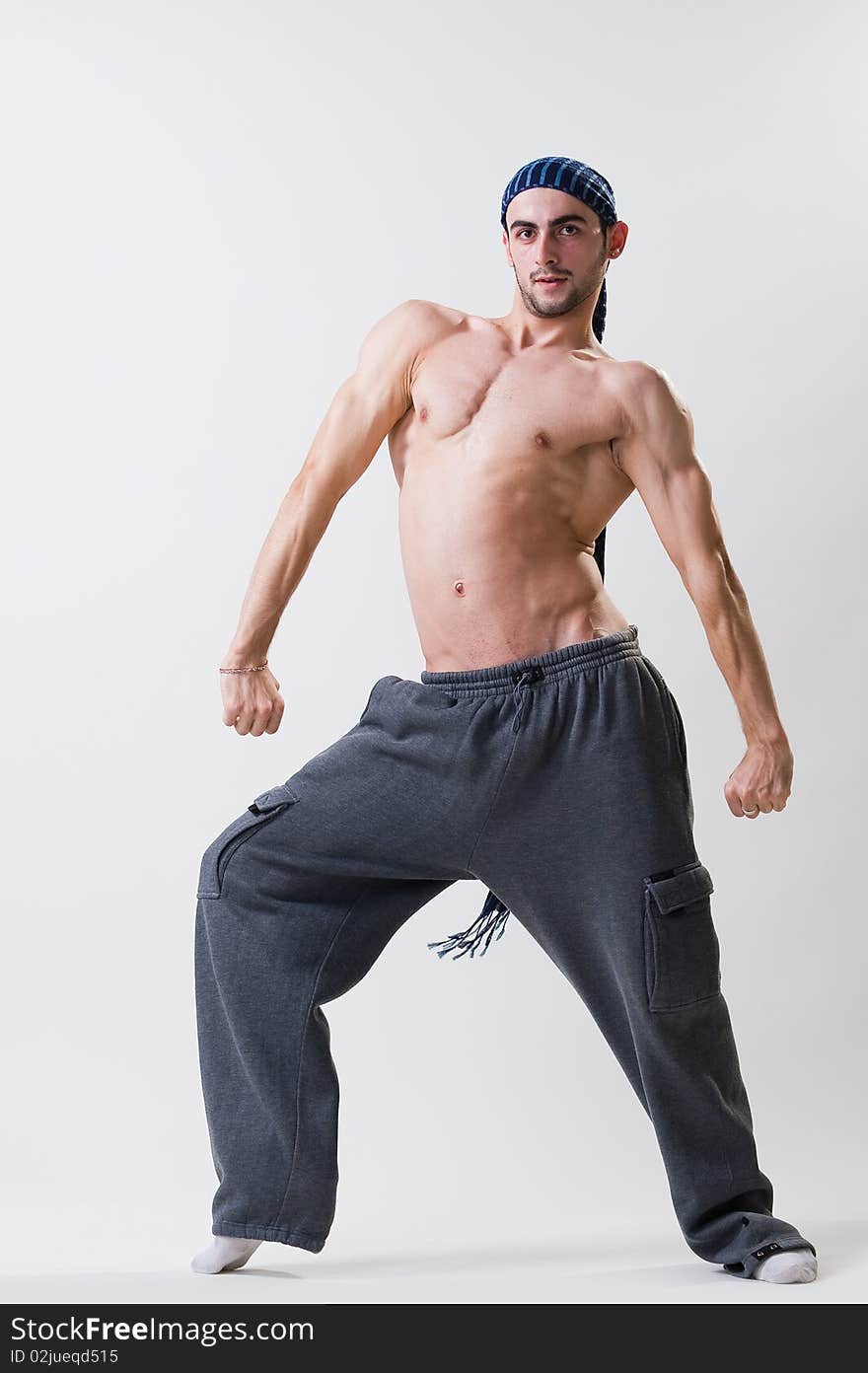 Young dancer exercising, studio shot