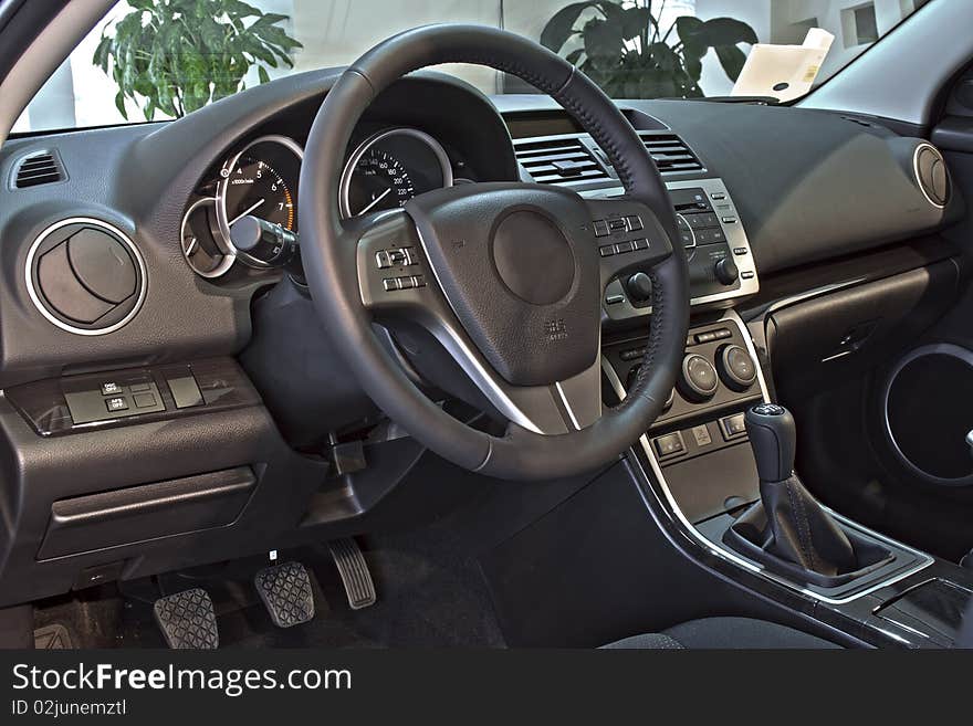 Steering wheel and instrument panel inside the car. Steering wheel and instrument panel inside the car