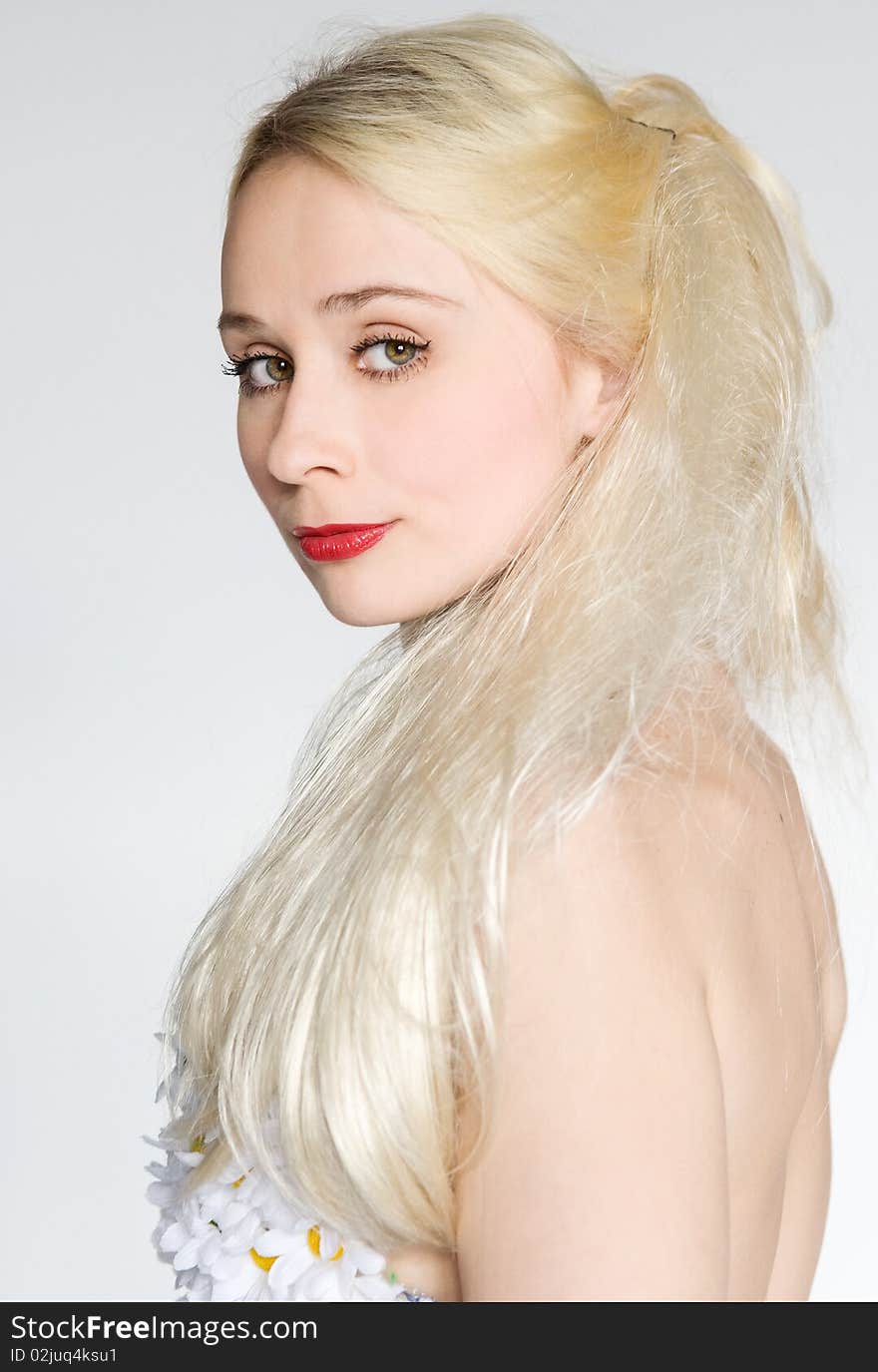 Close-up portrait of a gorgeous blonde woman with long hair red lipstick. Close-up portrait of a gorgeous blonde woman with long hair red lipstick