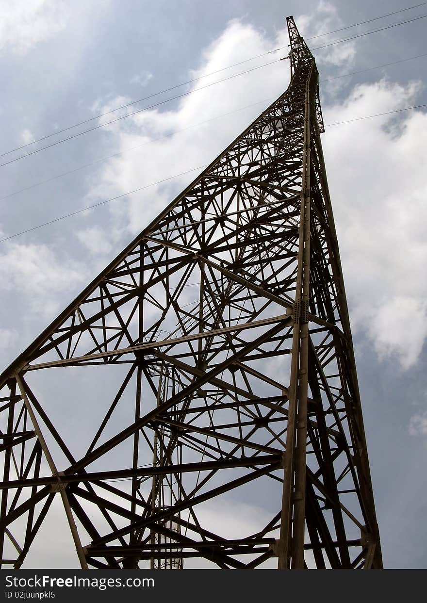 Electricity pylon against an intense blue sky