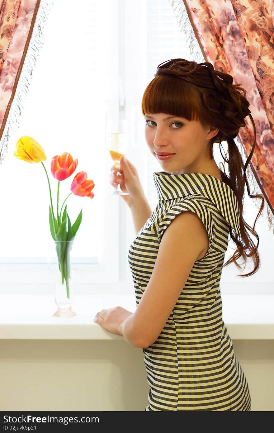 Attractive girl with a glass champagne