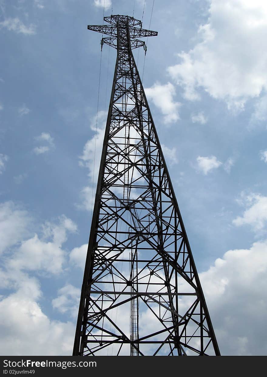 Electricity pylon against an intense blue sky