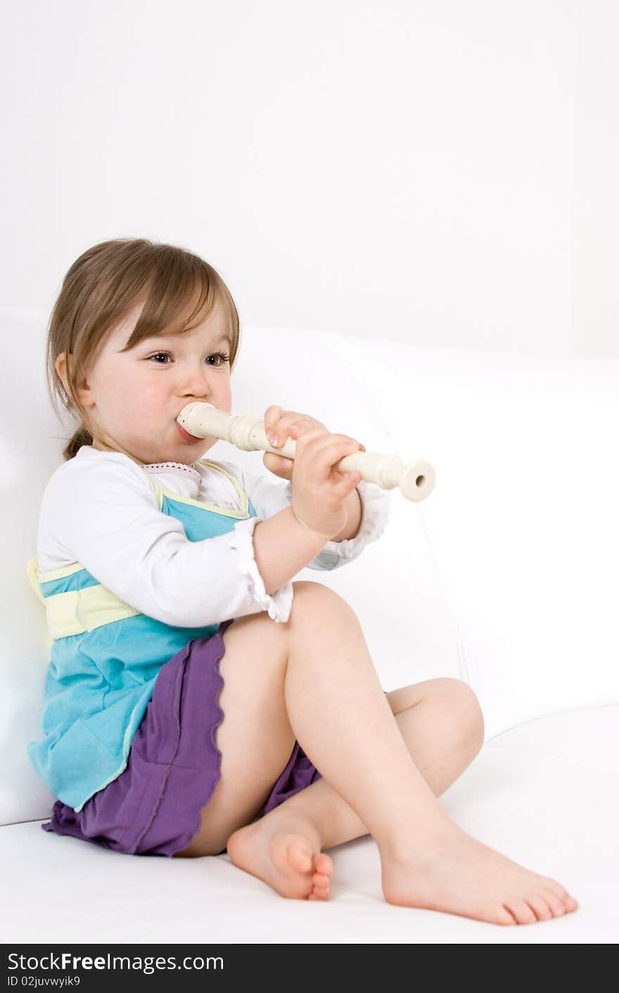 Happy little girl with instrument. Happy little girl with instrument