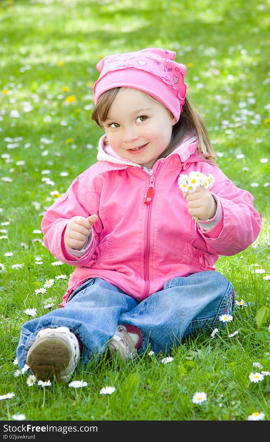 Sweet happy little girl in park