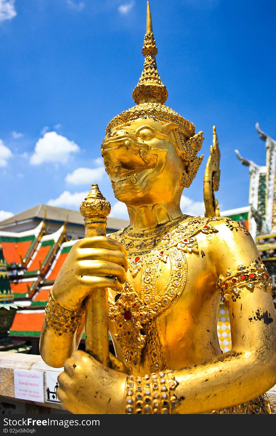 Statue of golden guardian Monkey at gate of grand palace in Thai kingdoms