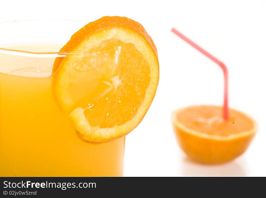 Orange with orange juice in front of white background