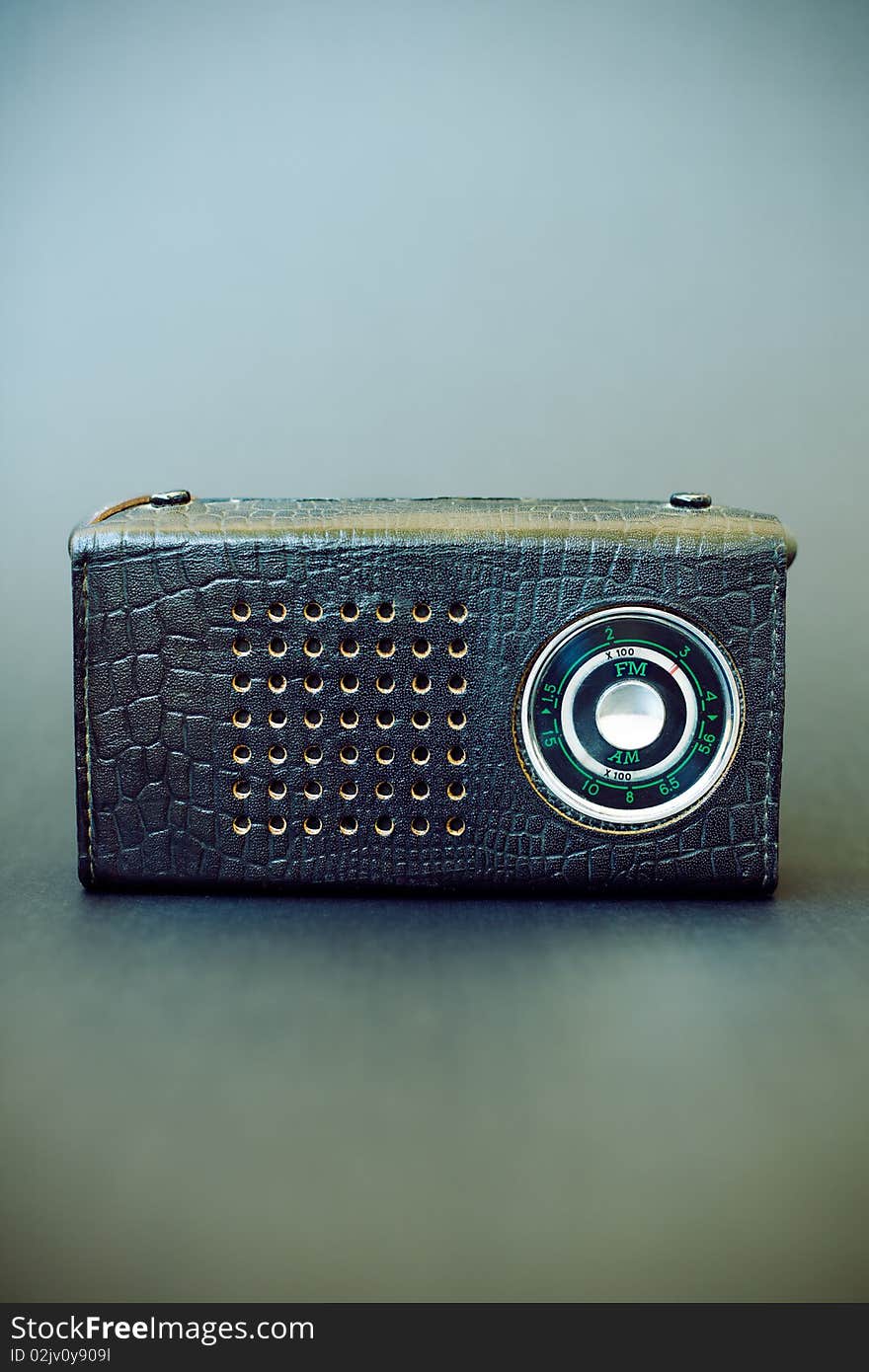 Vintage radio on gray grunge background