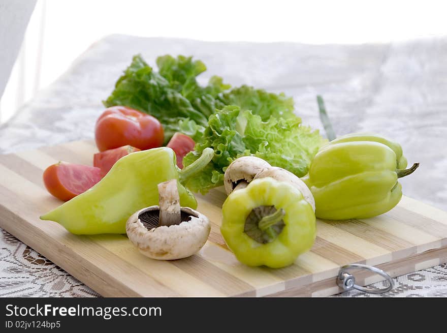 Preparing a fresh vegetable salad. Preparing a fresh vegetable salad.