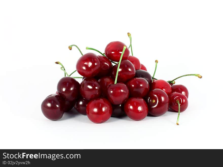 Heap of sweet cherries isolated on white