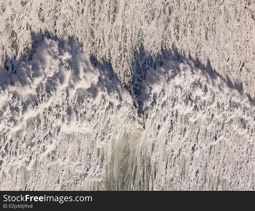 This shot of an oncoming wave was originslly taken on a vertical plane, 90 degrees from the horizontal presentation. In the course of changing the angle, a reverse optical illusion occurs. This shot of an oncoming wave was originslly taken on a vertical plane, 90 degrees from the horizontal presentation. In the course of changing the angle, a reverse optical illusion occurs.