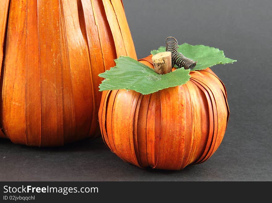 A pair of artistically created pumpkins on a white background. A pair of artistically created pumpkins on a white background.