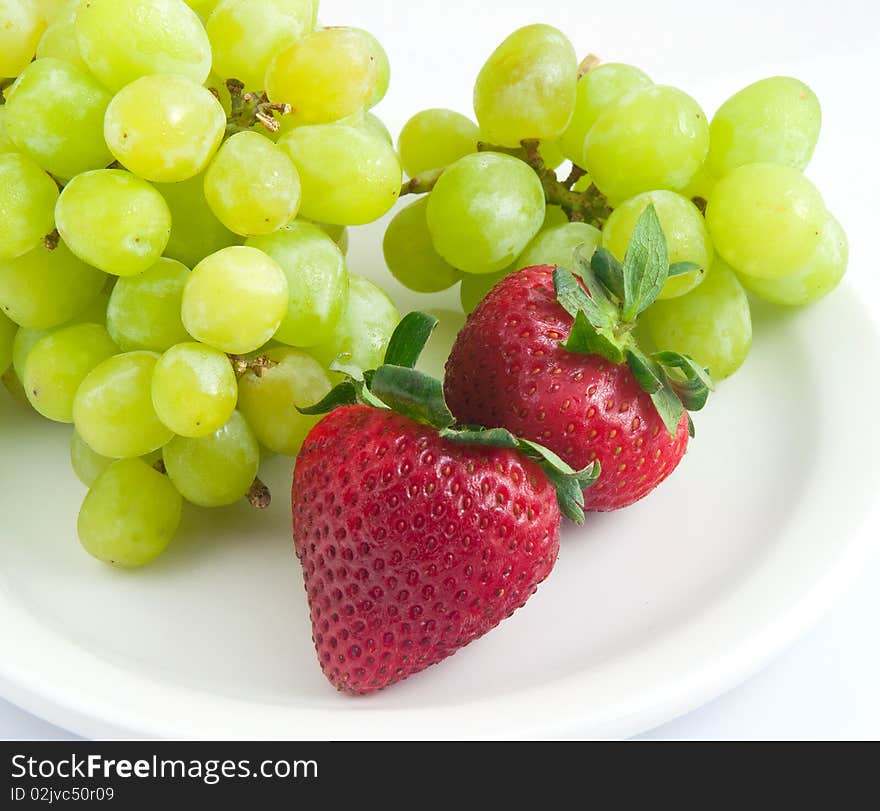 Fresh delicious strawberries green grapes. Fresh delicious strawberries green grapes