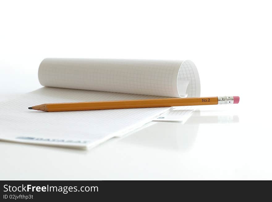 Notebook with the pencil on the white table. Notebook with the pencil on the white table