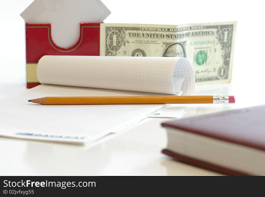 Notebook with the pencil on the white table. Notebook with the pencil on the white table