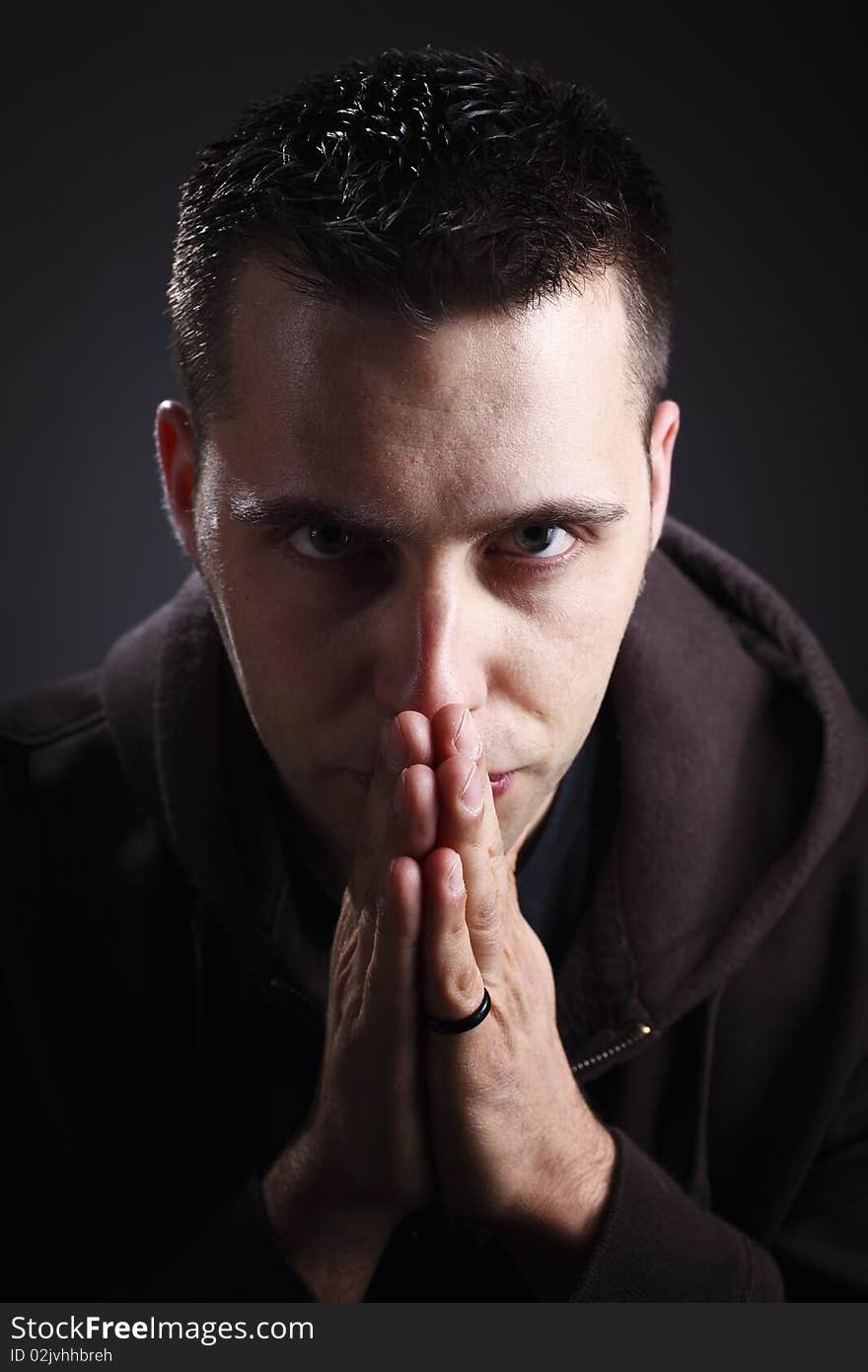 Thinking man portrait caucasian model on dark background