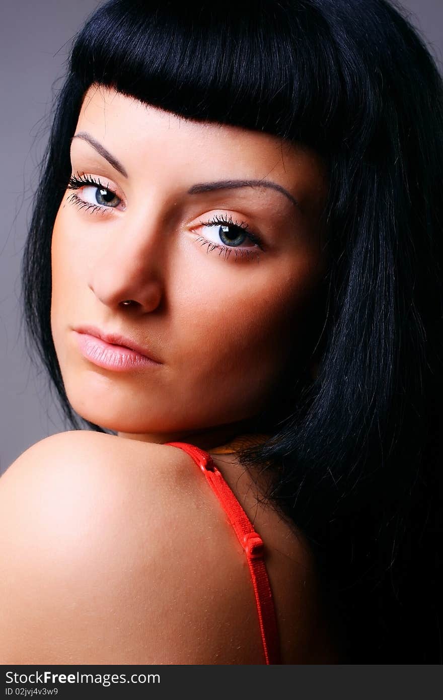 Close-up portrait of young woman with black hair. Close-up portrait of young woman with black hair