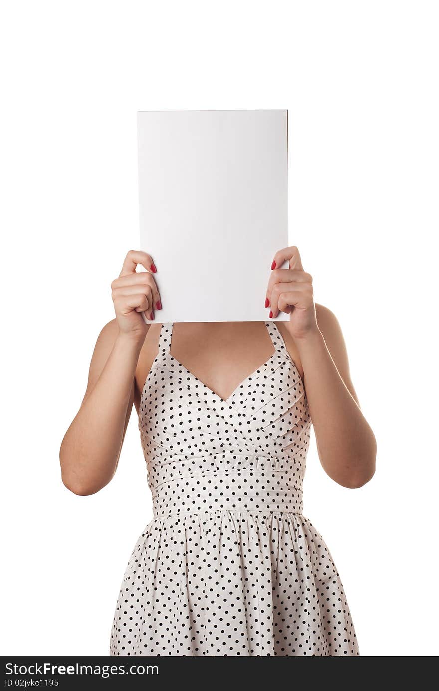 Young woman in white summer dress with the blank sheet of paper over his face isolated on white. Young woman in white summer dress with the blank sheet of paper over his face isolated on white