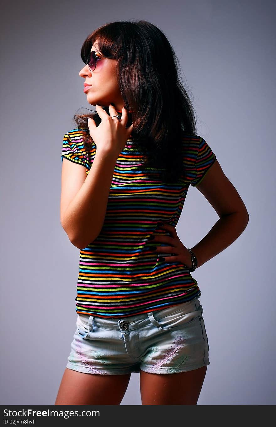 Studio shot of beautiful woman with stylish glasess