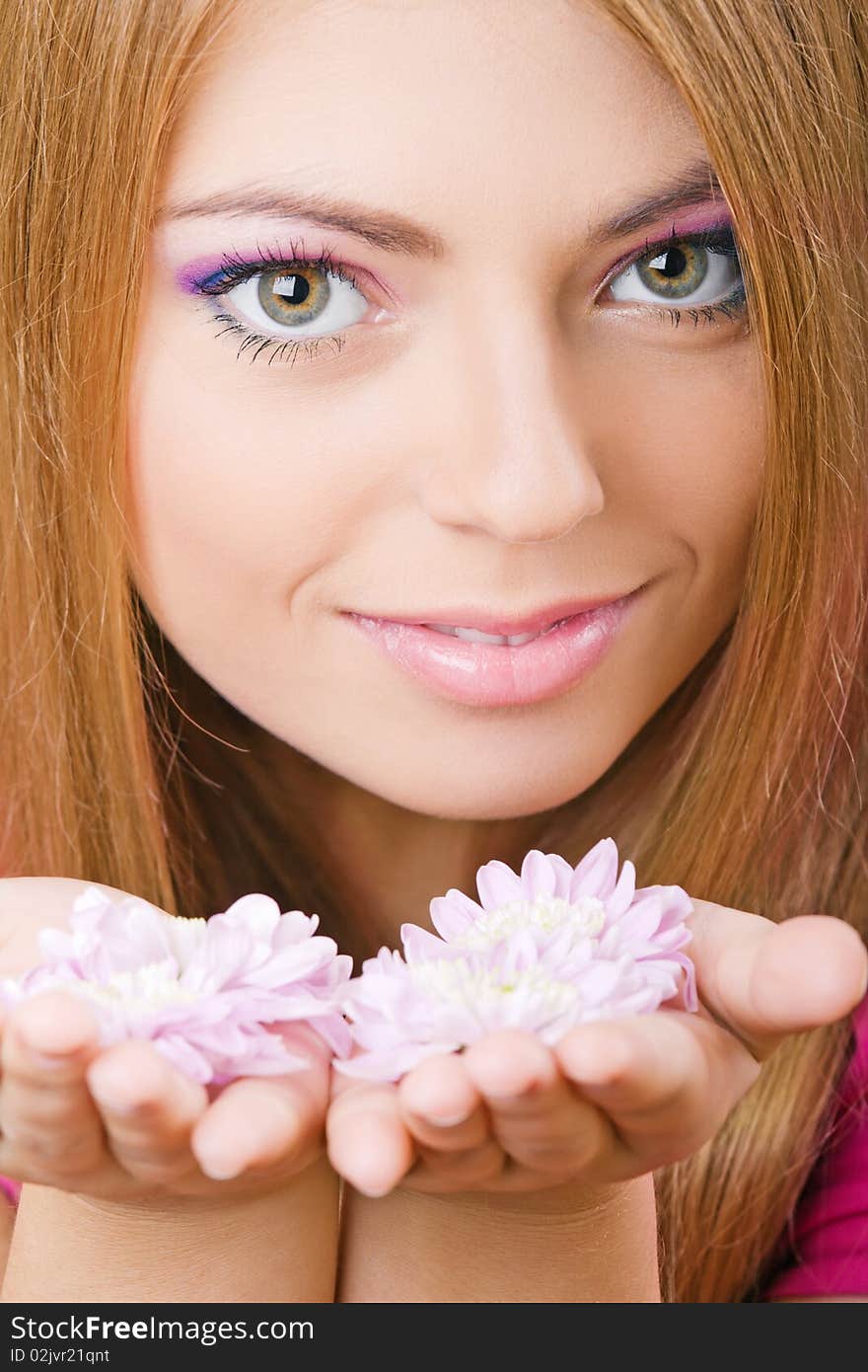 Young pretty girl with flowers portrait. Young pretty girl with flowers portrait