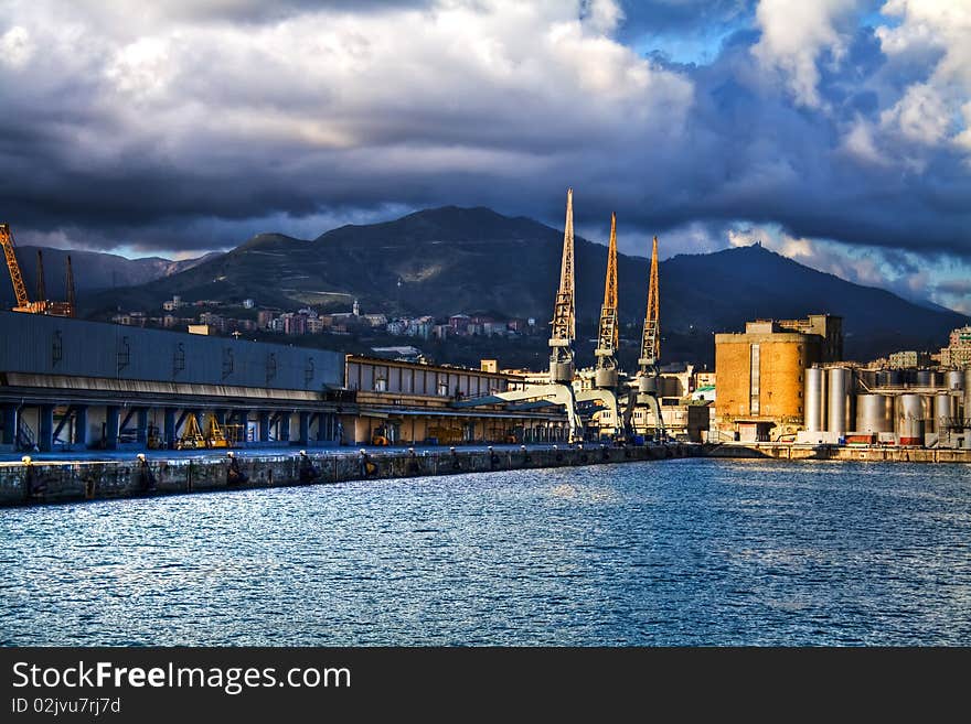 Three cranes on Genoa's cargo dock