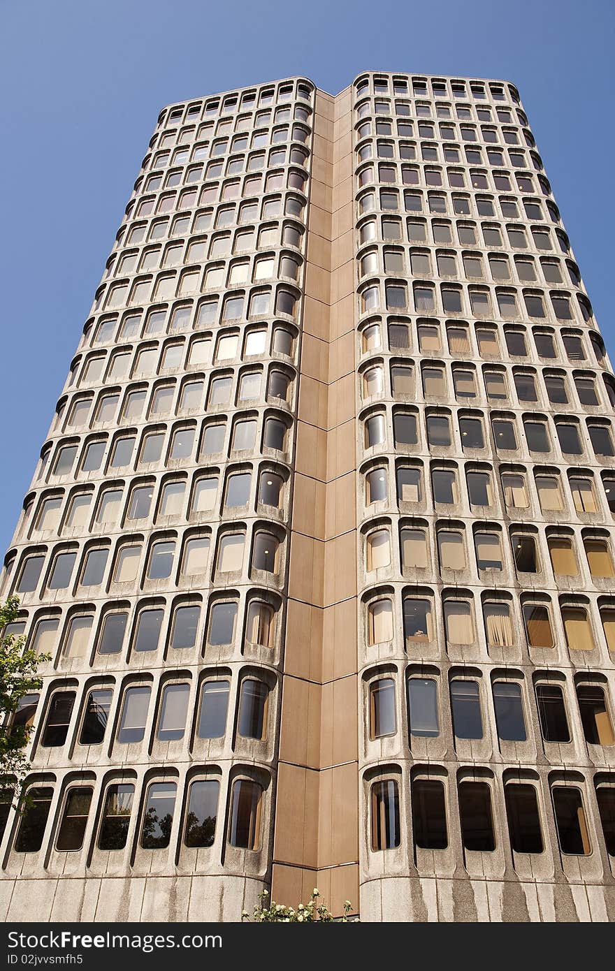 Vertical office construction in London blue sky