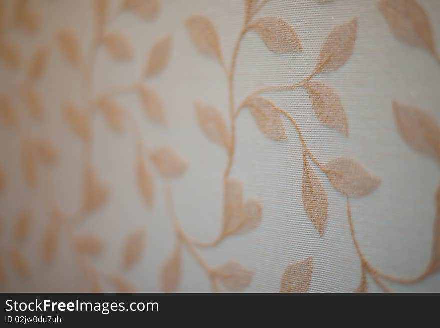 Close up of brown floral pattern on wallpaper. Close up of brown floral pattern on wallpaper