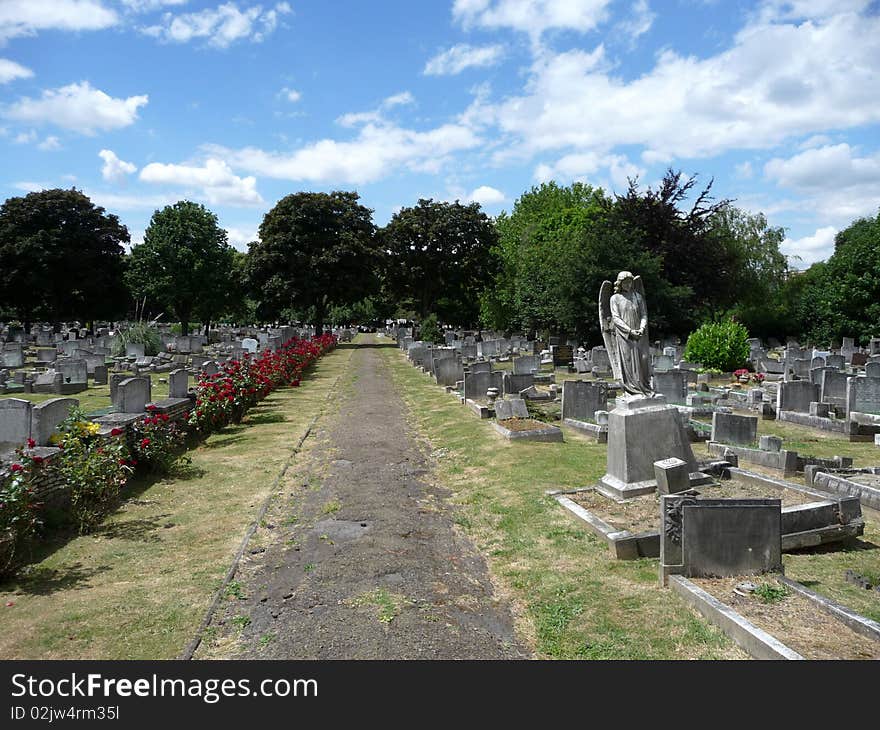 An stone angel in a London graveyard. An stone angel in a London graveyard.