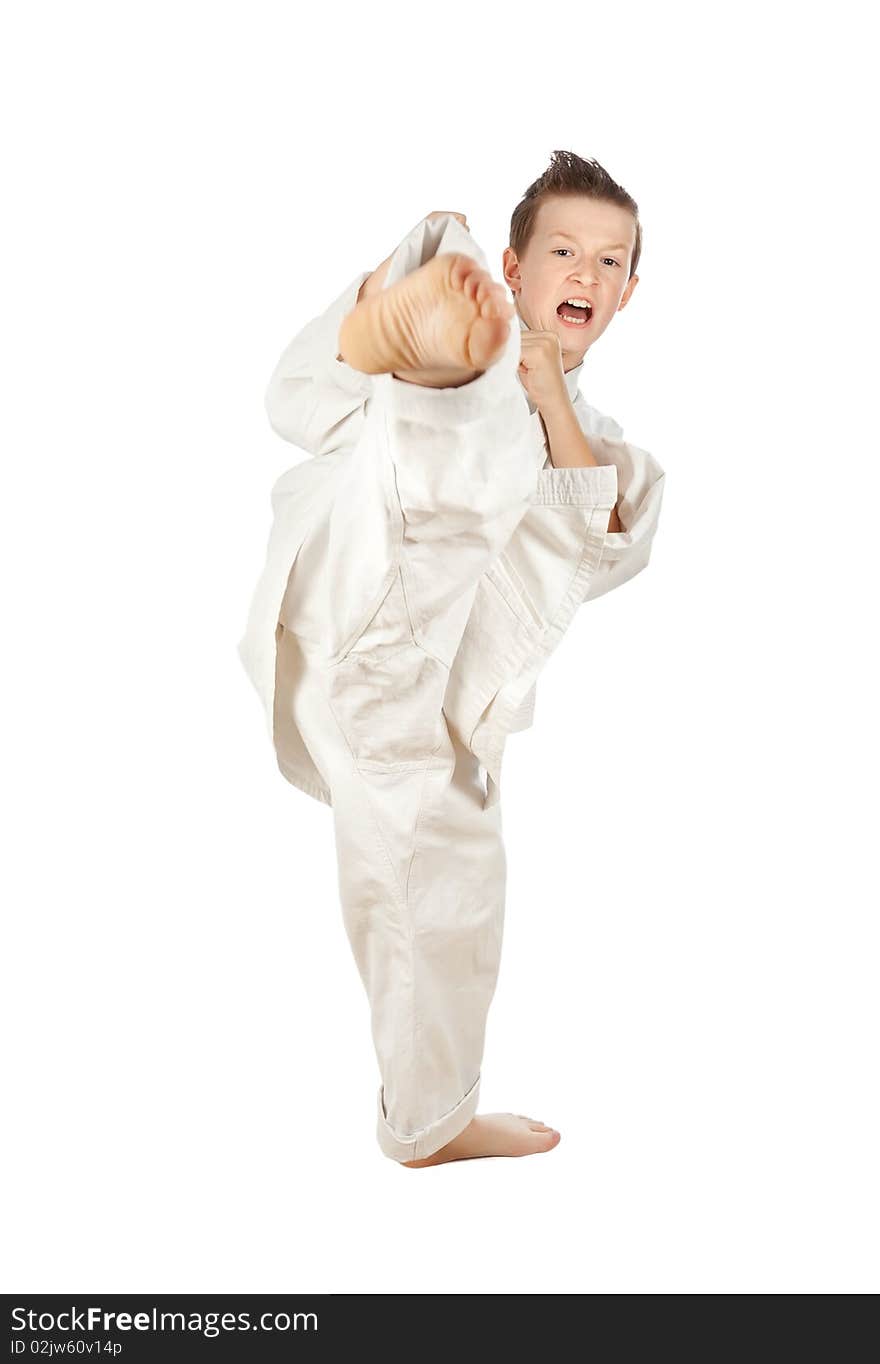 Young boy training karate. Isolated on white background. Young boy training karate. Isolated on white background