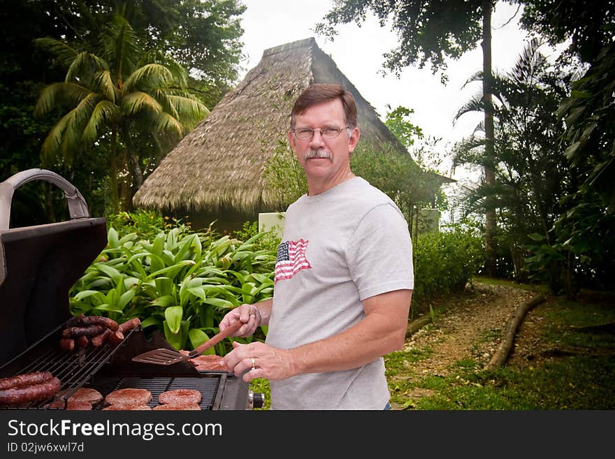 Mature man barbecuing