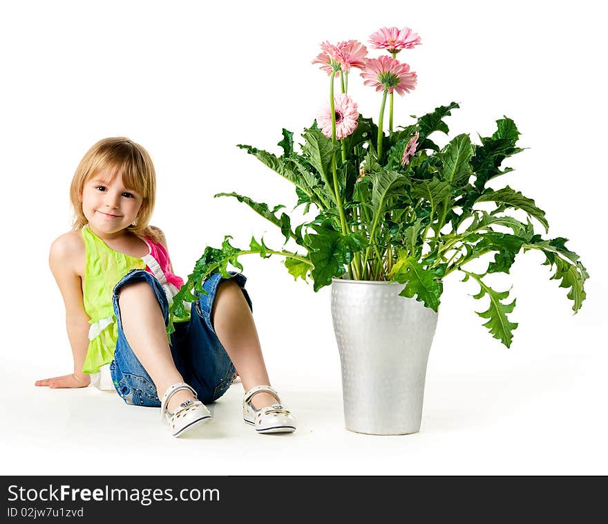 Cute little girl with the flowers. Studio shot. Cute little girl with the flowers. Studio shot